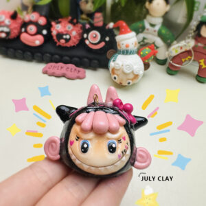 Black powder with Labubu clay pendant