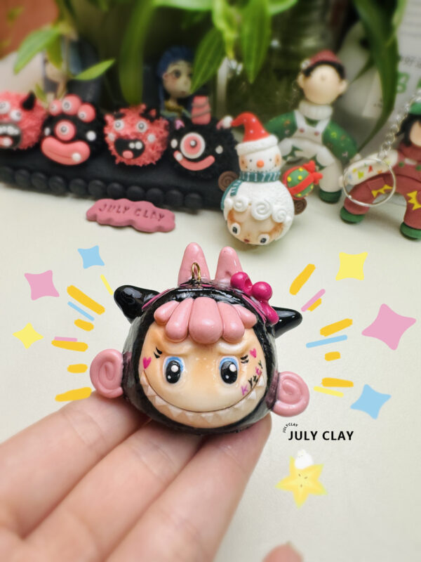 Black powder with Labubu clay pendant
